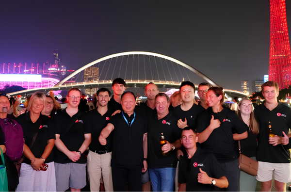HOCA delegation with Dr Howard Long in front of Guangzhou bridge at night
